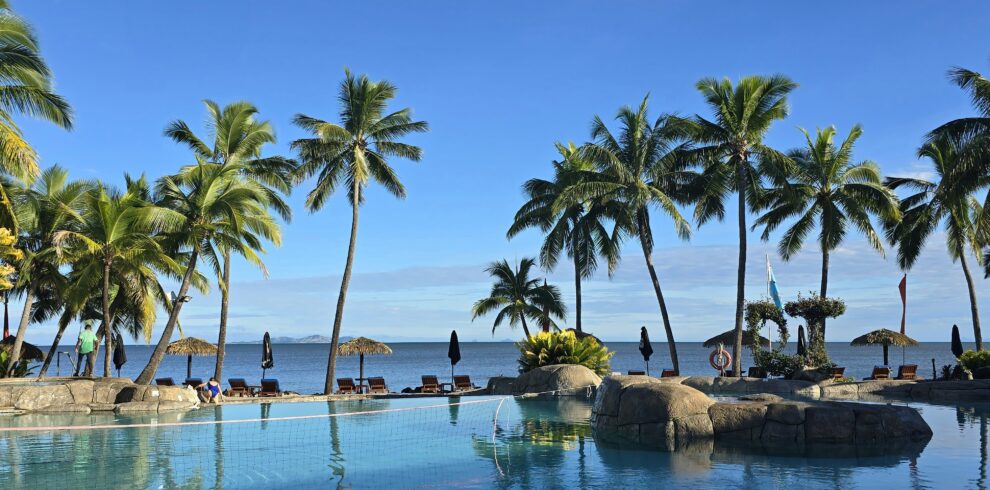 Luxury Goa tour package resort infinity pool sunset view